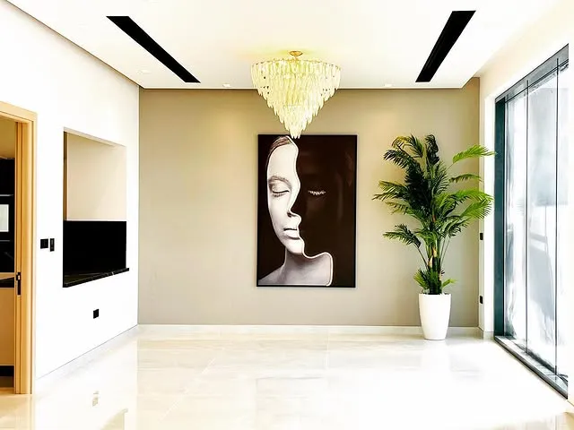 A contemporary art piece is showcased in the hallway, bringing an artistic flair to the surrounding environment.