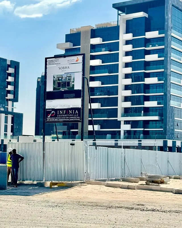 The exterior of the apartment building, highlighting its design and the inviting atmosphere of the neighborhood.